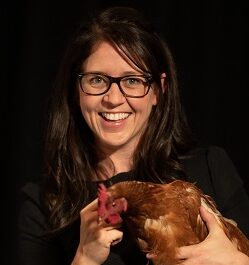 Peta Taylor Peta Taylor holding a chicken.